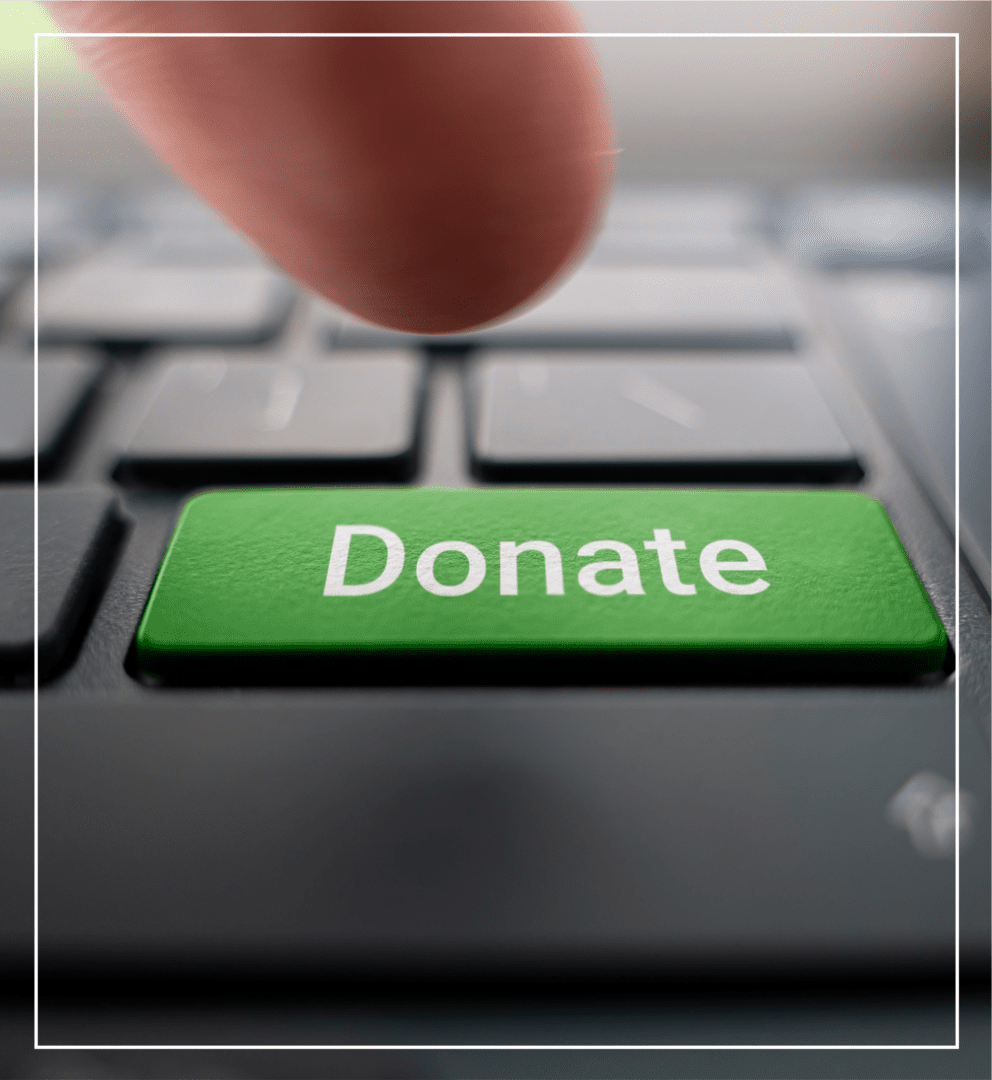 4 Close-up of a finger pressing a green "Donate" key on a keyboard.